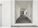 Welcoming entryway with stone floors that seamlessly guide you into the home at 8405 Golden Beach Ct, Parrish, FL 34219