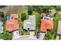Aerial view of the property showcasing its serene setting with lush greenery, mature trees, and a spacious yard at 12628 Daisy Pl, Bradenton, FL 34212