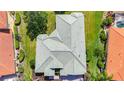 Drone shot of a landscaped house showcasing the roof and surrounding greenery at 12628 Daisy Pl, Bradenton, FL 34212
