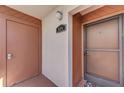 Condo entrance with secure door, door number and covered entrance at 1500 Cove Ii Pl # 524, Sarasota, FL 34242