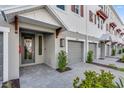 Close up view of a charming three-story townhome with a private garage and walkway at 1620 Sea Haven Dr # 404, Punta Gorda, FL 33950