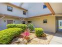 Beautiful courtyard with rock features and colorful landscaping at 1759 Lake Pl # 1759-B, Venice, FL 34293