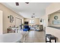 Open living room with tile flooring and lots of natural light at 1759 Lake Pl # 1759-B, Venice, FL 34293
