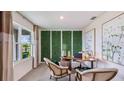 Bright office space with decorative wall paneling, large window, and modern décor at 18211 Canopy Pl, Lakewood Ranch, FL 34211