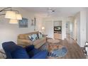 Bright living room features cozy seating, beach-themed decor, and plenty of natural light at 205 Highland Ave # 2, Bradenton Beach, FL 34217