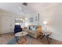 Comfortable living room with a sofa, accent chair, and stylish decor for a relaxing atmosphere at 205 Highland Ave # 2, Bradenton Beach, FL 34217