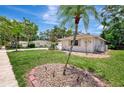 Well-maintained single-story home with manicured lawn and decorative landscaping, offering curb appeal at 2924 Valley Forge St, Sarasota, FL 34231