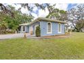Beautifully designed home with well-maintained lawn and an attached two-car garage at 361 Whitfield Ave, Sarasota, FL 34243
