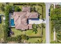 Aerial view showing the pool and architectural layout of a gorgeous property including the paver driveway at 4711 17Th W St, Palmetto, FL 34221