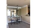 Dining room showcases a mirrored wall, decorative lighting, and modern seating at 4802 51St W St # 2010, Bradenton, FL 34210
