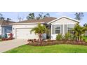 Beautiful single-story home with manicured landscaping and a convenient two-car garage at 5727 Oak Bridge Ct, Bradenton, FL 34211