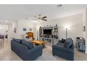 Comfortable living room with neutral tones, featuring plush seating and a decorative entertainment center at 5727 Oak Bridge Ct, Bradenton, FL 34211