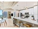 Contemporary kitchen boasts stainless steel appliances, island seating, and an open floor plan at 777 N Ashley Dr # 1712, Tampa, FL 33602