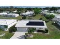 Charming home showcases solar panels, pristine tile roof, and well-manicured landscaping in a tranquil neighborhood at 1315 Bottlebrush Dr, Bradenton, FL 34208