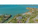 Located on a waterway, the property offers easy access to the bay and the home blends seamlessly with its surroundings at 1540 Hillview Dr, Sarasota, FL 34239