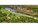 Gorgeous aerial showcasing the waterfront condos overlooking the golf course at 17118 Vardon Ter # 101, Bradenton, FL 34211