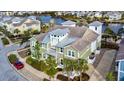 Inviting two-story home boasting lush landscaping, complemented by mature palm trees and pristine sidewalks at 319 Compass Point Dr # 201, Bradenton, FL 34209