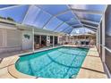 Inviting screened-in pool area featuring comfortable seating and a clear blue pool perfect for relaxation at 3402 Key Ave, Sarasota, FL 34239