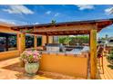 An outdoor kitchen featuring a stainless steel grill and tiled countertop, perfect for entertaining guests at 3716 Coconut Ter, Bradenton, FL 34210