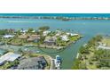 Waterfront home featuring a screened-in pool and a private boat dock with quick access to the Gulf of Mexico at 452 Picasso Dr, Nokomis, FL 34275