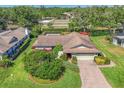 Charming home with a well-manicured lawn and brick paver driveway at 4806 Huntleigh Dr, Sarasota, FL 34233