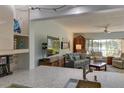 Cozy living room with lake views and comfortable seating, adjacent to the kitchen area at 5395 Lake Arrowhead Trl # 24, Sarasota, FL 34231