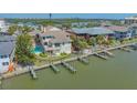 Waterfront home with private boat docks, pool, and balcony providing access to the waterway at 9034 Midnight Pass Rd # 6, Sarasota, FL 34242
