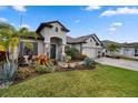 Charming front yard featuring professional landscaping, stone accents, and a well-manicured lawn at 12715 Wheatgrass Ct, Parrish, FL 34219