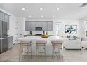 Open kitchen with a large island, modern gray cabinets, and sleek countertops at 172 Eagleston Ln, Sarasota, FL 34240