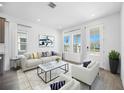 Bright living room features stylish furniture, neutral colors, and great natural light at 172 Eagleston Ln, Sarasota, FL 34240