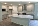 Spacious kitchen features a large island, stainless steel appliances, and modern cabinetry at 19575 Fort King Run, Brooksville, FL 34601