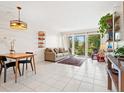 Inviting living room filled with natural light, neutral furnishings, and tile flooring at 2155 Wood St # B18, Sarasota, FL 34237