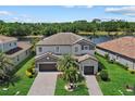 An aerial shot of a gorgeous home near a lake, highlighting the property's prime location and curb appeal at 2818 Starwood Ct, Lakewood Ranch, FL 34211
