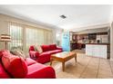 Open-concept living room with views of the kitchen and dining area, offering a spacious layout at 337 Somerset Ave, Sarasota, FL 34243
