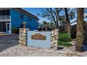 Entrance sign for Cayman Cay community at 4307 Gulf Dr # 109, Holmes Beach, FL 34217