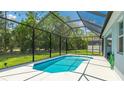 Screened-in pool with sunny white deck and backyard at 4325 Renwick Dr, Parrish, FL 34219