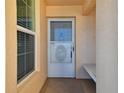 Apartment entrance with white screen door, unit number 604, and exterior bench at 4460 Fairways Blvd #604 Blvd # 604, Bradenton, FL 34209