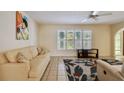 Comfortable living area with plenty of natural light and a decorative rug, perfect for relaxing at 6004 10Th Ave W, Bradenton, FL 34209