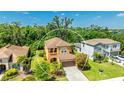 Aerial view of a well-maintained two-story home with lush landscaping at 6111 Horse Mill Pl, Palmetto, FL 34221