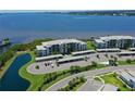 Scenic aerial view of condos overlooking water with covered parking and well-maintained landscaping at 850 Tidewater Shores Loop # 202, Bradenton, FL 34208