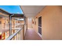 A condo hallway with outdoor access, showing the exterior of the unit at 1330 Glen Oaks E Dr # 374D, Sarasota, FL 34232