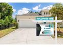 Attractive home featuring an attached garage, and lush landscaping at 1800 Little Bird Ct, Sarasota, FL 34235