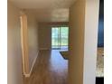 Inviting living room with tile floors and sliding glass doors to a patio area at 205 46Th Avenue W Ter # 425, Bradenton, FL 34207