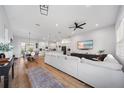 Bright, open-concept living room flows into dining and kitchen areas, perfect for entertaining at 2366 Ann Arbor Rd, North Port, FL 34286
