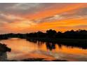 Scenic sunset view over the water with colorful skies and reflections at 2705 Taheebo Way, North Port, FL 34289