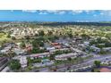 Panoramic aerial view of a neighborhood with houses and condo complexes on a bright, sunny day with a clear blue sky at 3500 Beneva Rd # 306, Sarasota, FL 34232