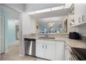 Contemporary kitchen with stainless steel dishwasher and ample counter space at 400 Laurel Lake Dr # 104, Venice, FL 34292