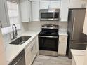 Updated kitchen with stainless steel appliances and quartz countertops at 4505 3Rd Street W Cir # 269, Bradenton, FL 34207