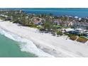Stunning beachfront property with panoramic ocean views and lush landscaping, ideal for luxurious coastal living at 5055 Gulf Of Mexico Dr # 435, Longboat Key, FL 34228