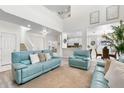 Spacious living room with high ceilings, featuring stylish decor and an open layout at 5915 43Rd E Ct, Bradenton, FL 34203